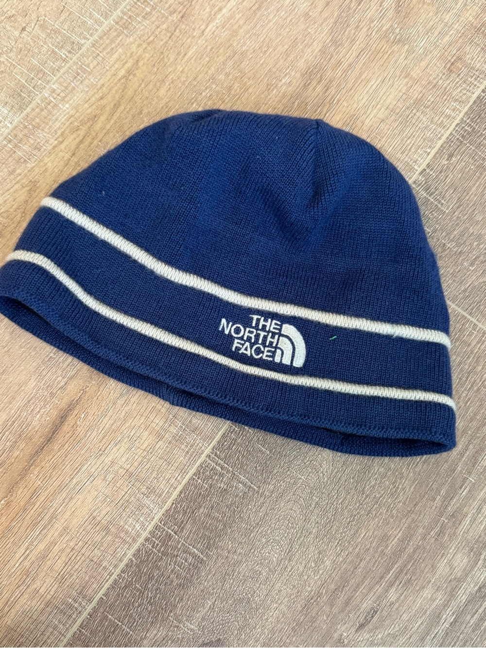 The North Face infant Navy Beanie with Cream Stripe Accents